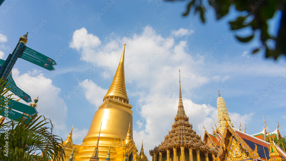 Fototapeta premium Tourists at the Grand Palace a famous tourist destination that includes the Temple of the Emerald Buddha (Wat Phra Kaew) the most sacred Buddhist temple in Thailand