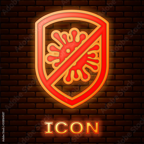 Glowing neon Stop virus, bacteria, germs and microbe icon isolated on brick wall background. Antibacterial and antiviral defence, protection infection. Vector Illustration