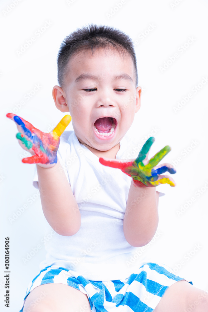 Asian portrait little baby boy show hand he have water color or finger paint on hands Asian portrait little baby boy show hand he have water color or finger paint on hands