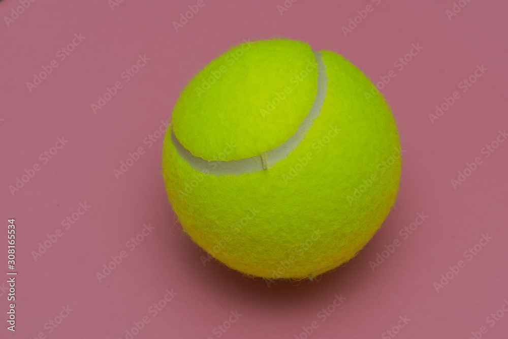 tennis ball on a pink background