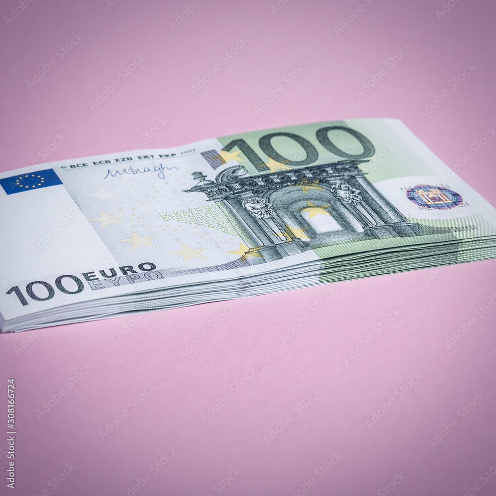Euro cash on a lilac, purple and pink background. Euro Money Banknotes. Euro Money. Euro bill. Place for text. Euro cash on a lilac, purple and pink background. Euro Money Banknotes. Euro Money. Euro bill. Place for text.