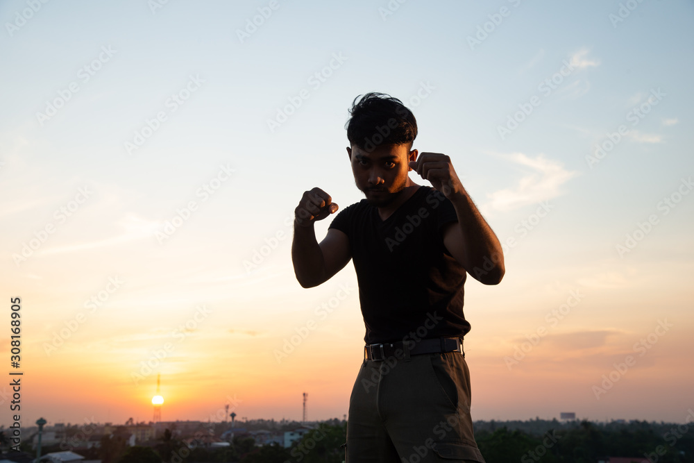 man posing mauy thai in rooftop man posing mauy thai in rooftop