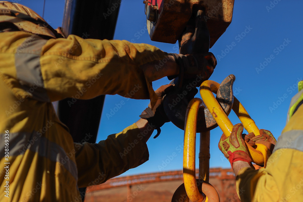 Construction male rigger hands wearing a heavy duty safety protection ...