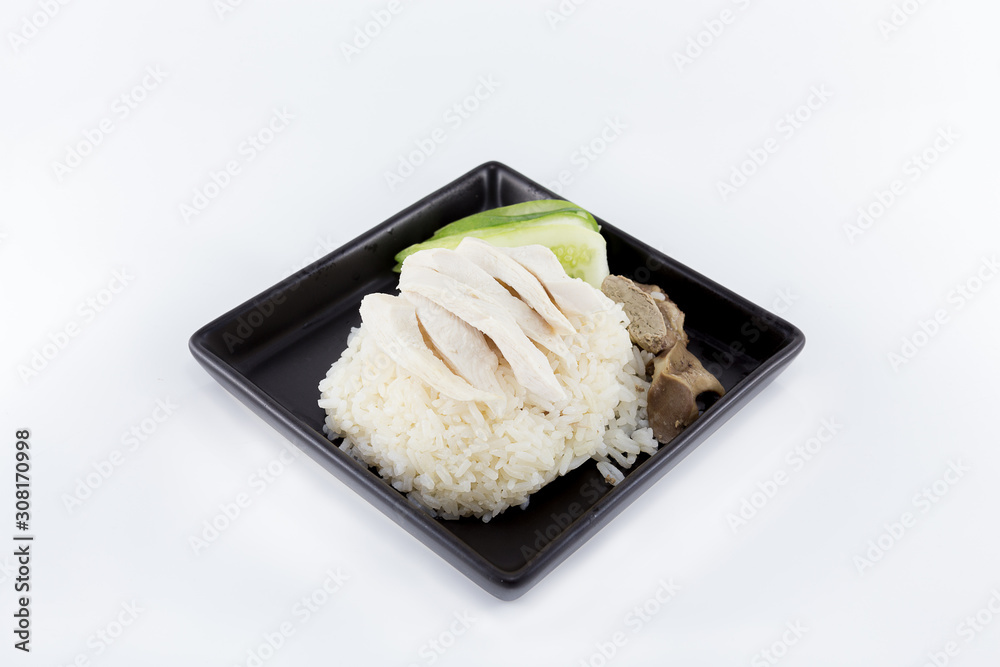 Hainanese chicken rice or steamed chicken rice served on square shape dish isolated on white background. Hainanese chicken rice or steamed chicken rice served on square shape dish isolated on white background.