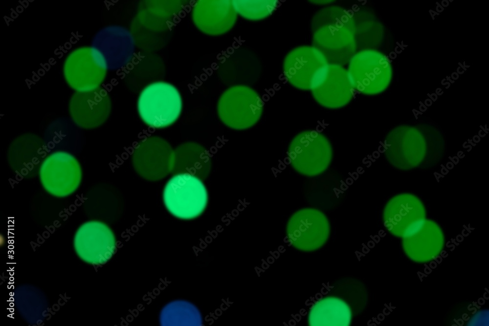 Garland lights on the Christmas tree. Blurred defocused christmas background for design. Garland lights on the Christmas tree. Blurred defocused christmas background for design.