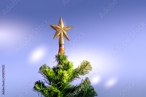 фотографія Star atop the Christmas tree - Merry Christmas.