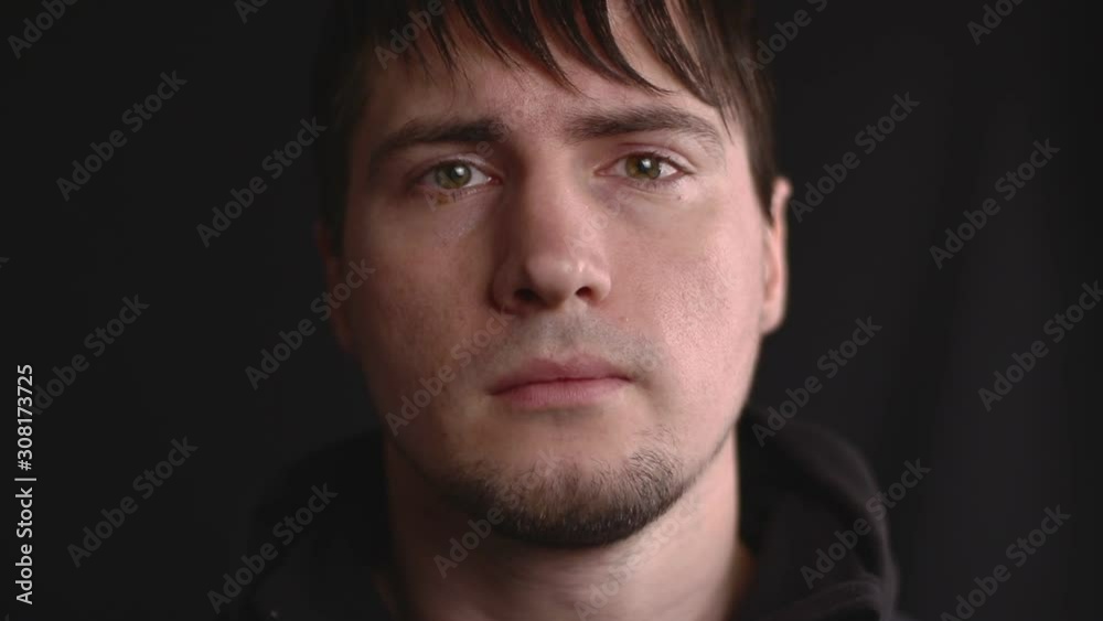 Close up emotional portrait of the young male shaking head in suspicion, failure, disagreement, doubt and lack of trust Close up emotional portrait of the young male shaking head in suspicion, failure, disagreement, doubt and lack of trust