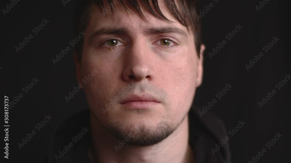 Close up emotional portrait of the young male being angry, betrayed and disappointed Close up emotional portrait of the young male being angry, betrayed and disappointed