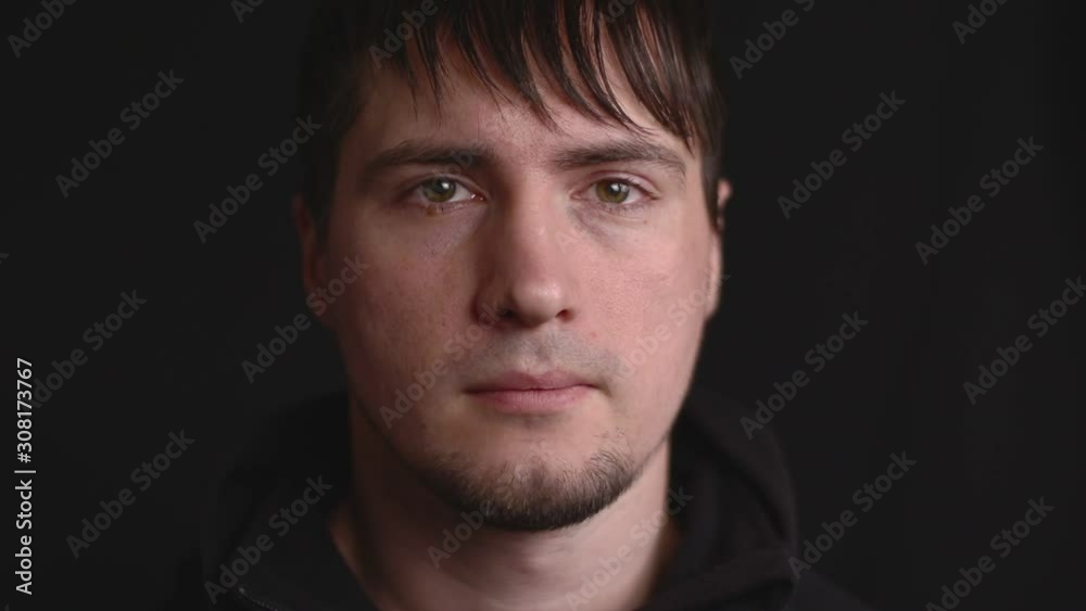 Close up emotional portrait of the young male frowning eyes in suspicion, failure, disagreement, doubt and lack of trust Close up emotional portrait of the young male frowning eyes in suspicion, failure, disagreement, doubt and lack of trust