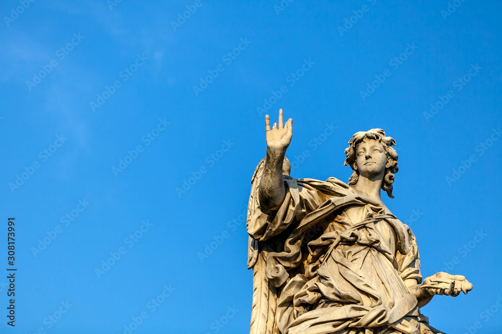 Fototapeta premium Statue of an angel on the Bridge of the Holy Angel (Eliev) in Rome, Italy.