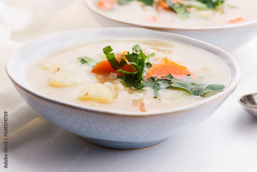 Barley soup, pearl barley in white bowl