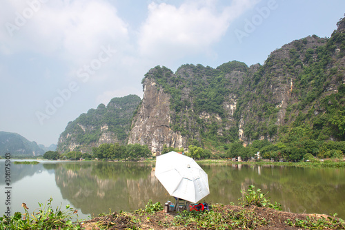 Panoramic view of karst formations in Tam Coc, a part of Trang An Complex , was declared a UNESCO World Heritage Natural and Cultural Monument.Ninh Binh province, Vietnam © Hans Gert Broeder