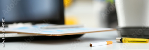 Billede på lærred Cigarette and lighter lying at worktable