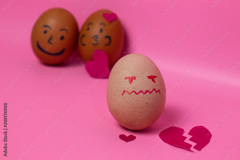 egg with a broken heart expression isolated in a pink background