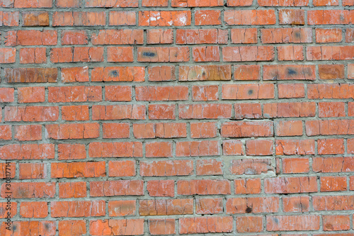 Old brick wall of red color, panorama of masonry. Texture background.