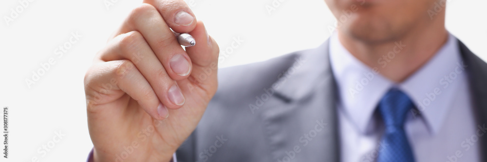 Male arm in suit and tie point in camera Male arm in suit and tie point in camera