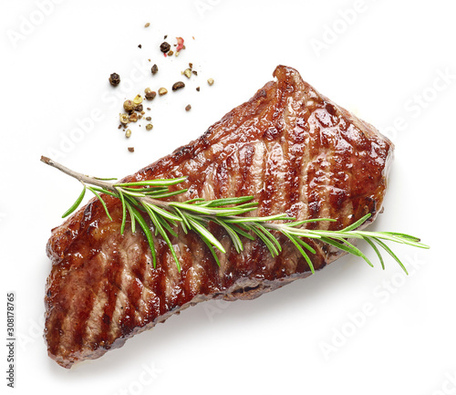 Grilled beef steak with rosemary and pepper isolated on white background top view