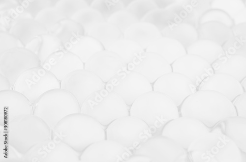 White soft light texture of heap transparent balls as elegant modern abstract background with perspective.
