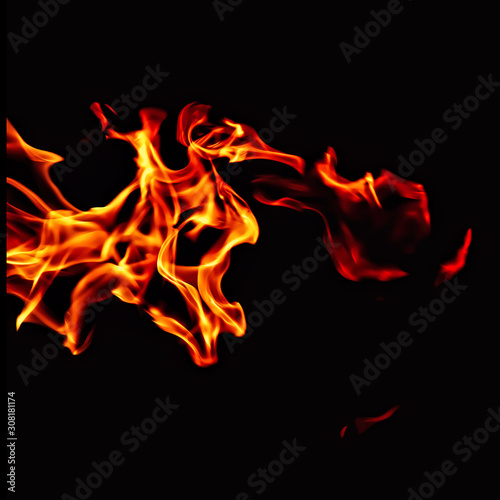 Fire flame isolated on black background. Beautiful yellow  orange and red blaze fire flames. For action design.