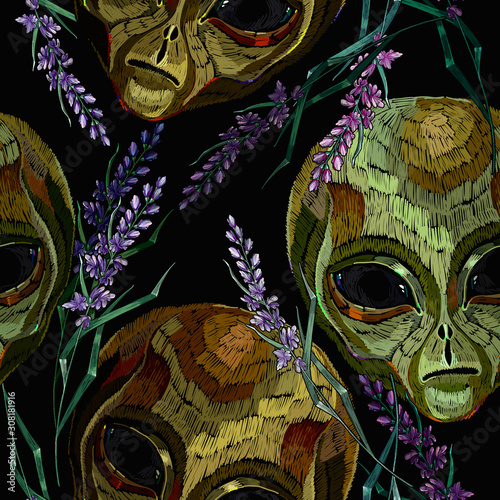Embroidery. Alien head and lavender flowers, seamless pattern. Pop culture style, science fiction art. UFO, paleocontact concept. Funny template for clothes