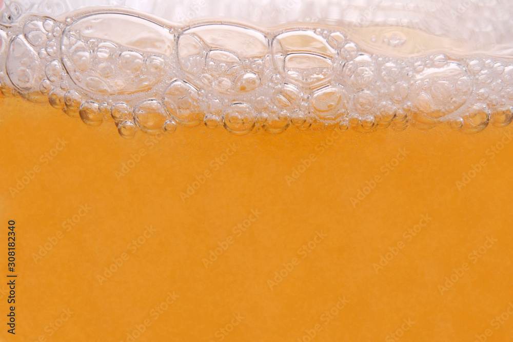 close up on the foam and the bubbles of the glass of beer close up on the foam and the bubbles of the glass of beer