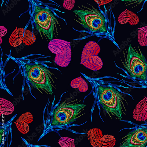 Embroidery peacock feathers and red hearts seamless pattern. Symbol of love, passion. Classical fashionable art. Template design of clothes