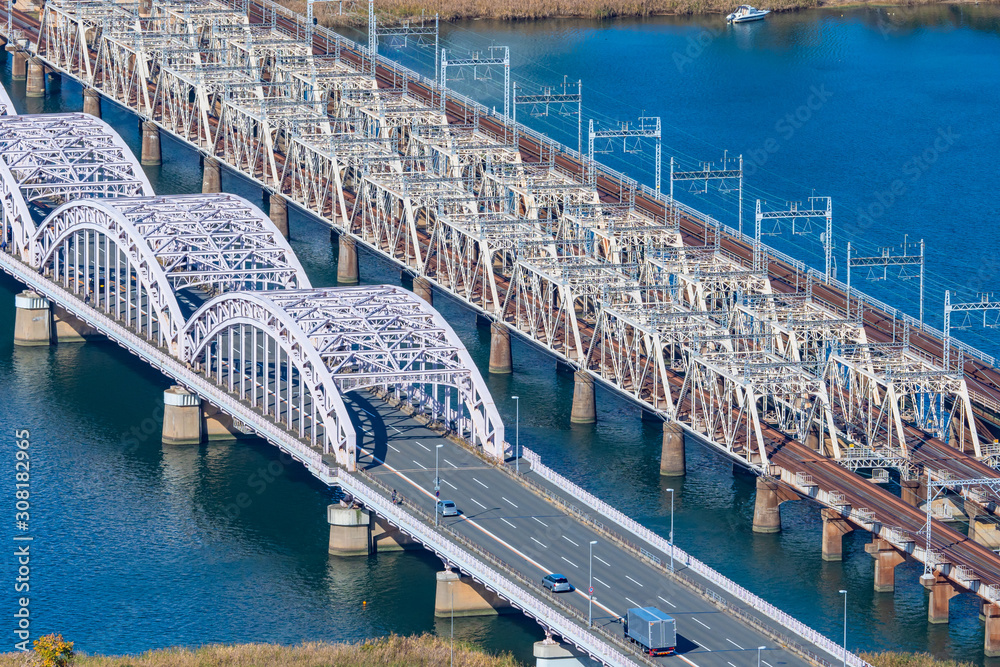 Osaka. Japan. Bridges over Yodo River. Automobile and railway bridge. Road architecture. Roads in Japan. Train travel in Japan. Railway to the city of Osaka. Car ride on the bridge. Bridge top view