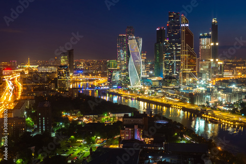 Moscow City. Russia. Area with skyscrapers. Tours of Moscow at night. Skyscrapers on the river bank. Night illumination of the city. Tall buildings. Vacation in Russia. Architecture. Sights.
