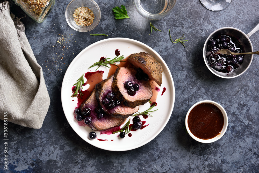 Sliced grilled beef with blueberry sauce Sliced grilled beef with blueberry sauce