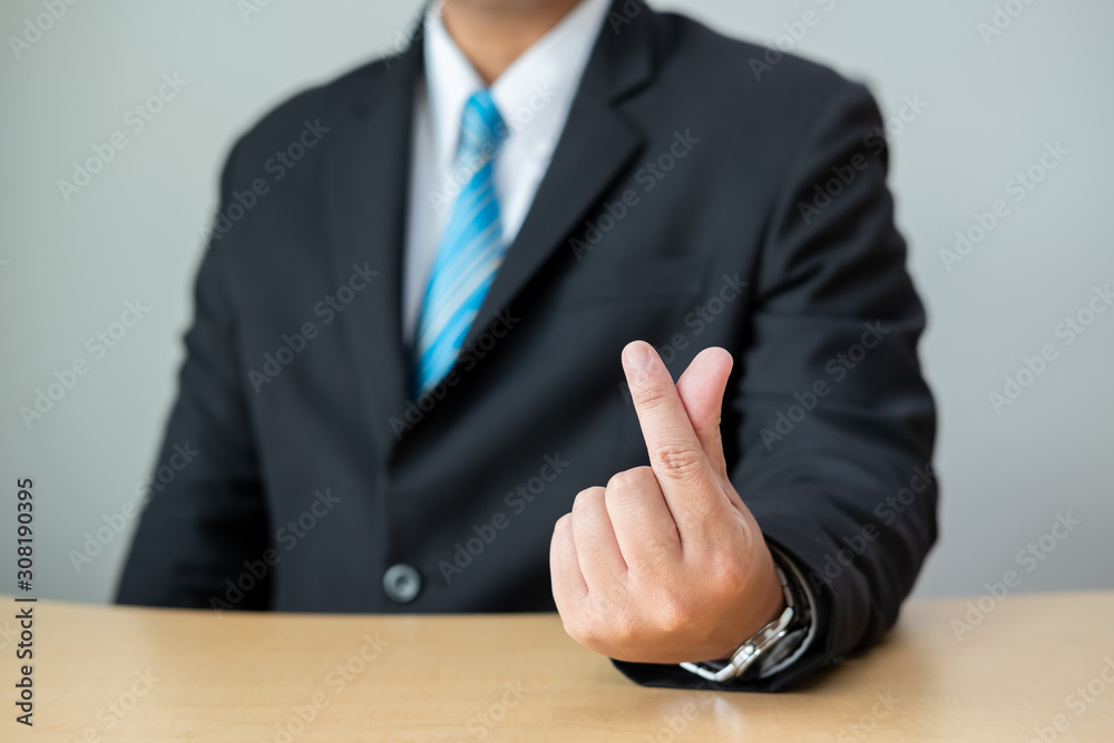 Business people wear suits and blue tie.Businessman doing a love symbol.