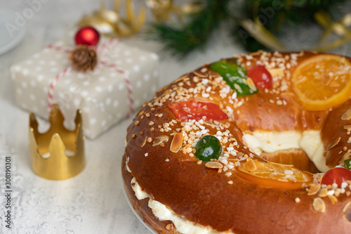 Spanish Christmas cake, Roscon de reyes , desert eaten in Spain for celebrate Epiphany or Dia de Reyes Magos, Three Wise Men Day. Spanish Christmas with traditional crown photo