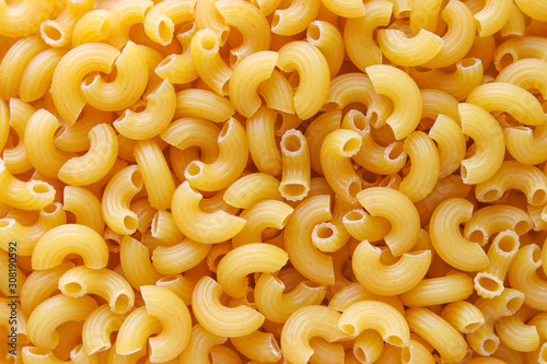 Macaroni spaghetti pattern background. Macaroni is a type of pasta.