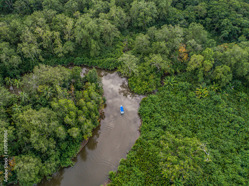 Aerial view of boat in the mangrove Rio Sierpe river in Costa Rica deep inside the jungle