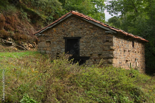 Old stone hut at the hiking track from Pido to Las Ilces in national park Picos de Europa in Cantabria,Spain,Europe © kstipek
