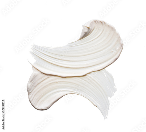 White smear and texture made by face clay or cream isolated on white background.