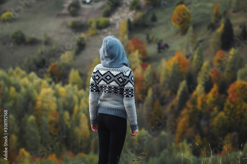 Autumn girl standing backwa...