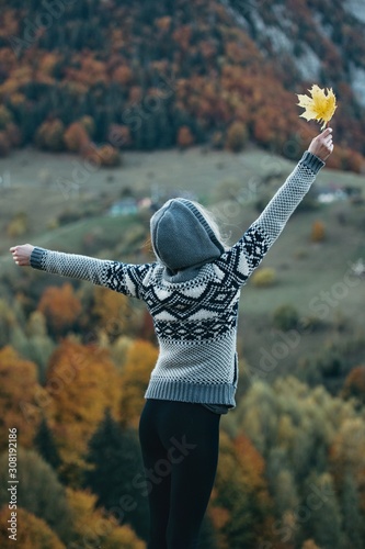 Young woman with raised up ...