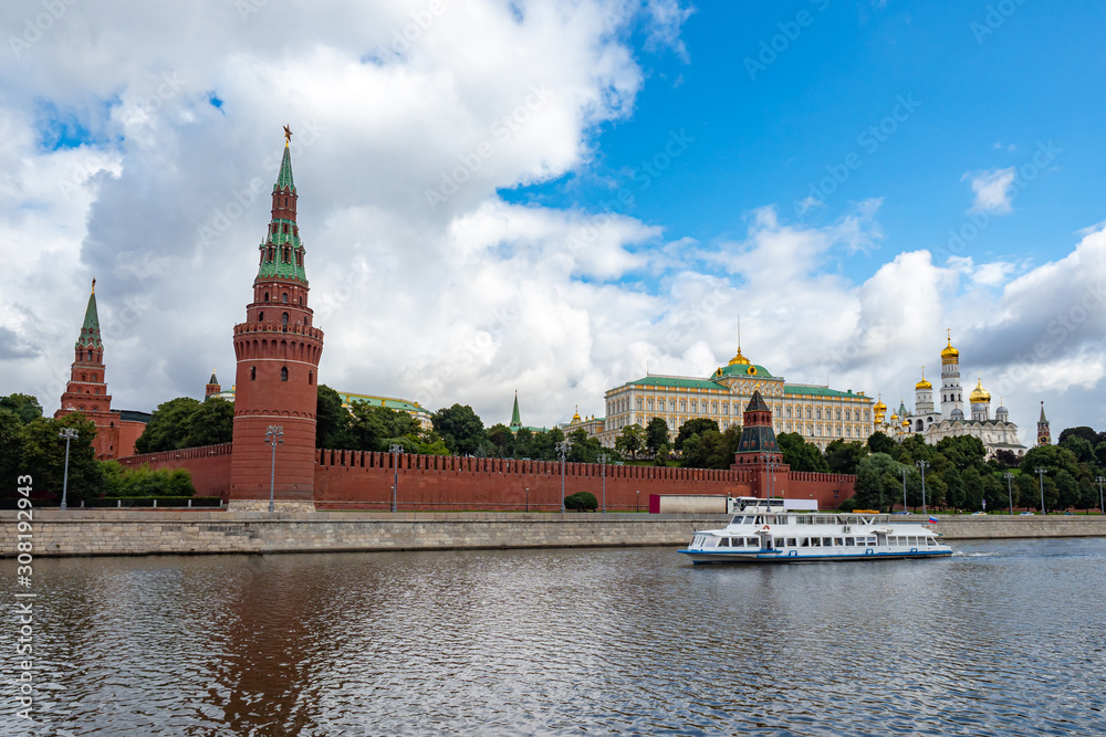 Kremlin in Moscow. Russia. The motor ship swims past the Kremlin. Tours on the Moscow River. Excursions on a water tram. The walls of the Kremlin. Moscow on a summer day. Sights of Russia.