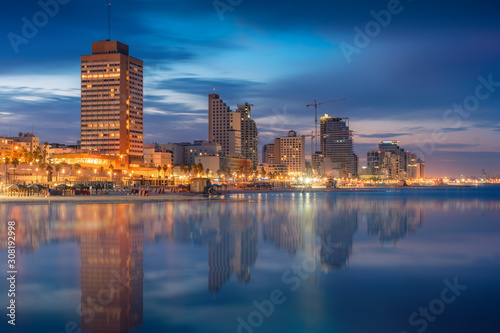 Tel Aviv Skyline  Israel. Cityscape image of Tel Aviv beach with some of its famous hotels during sunrise and night