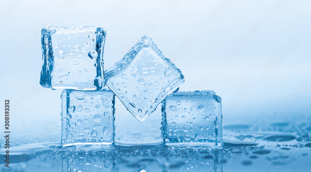 Ice cubes square with drops water clean on blue background Ice cubes square with drops water clean on blue background
