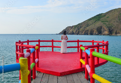 An Asian woman enjoying the sea