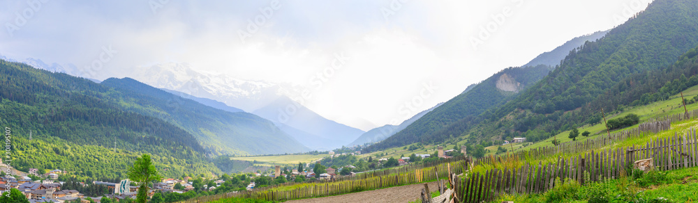 Panoramic view of Svan Towers in Mestia at sunset, Svaneti region, Georgia. It is a highland townlet in the northwest of Georgia, at an elevation of 1500 meters in the Caucasus Mountains