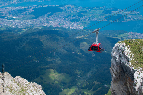 A Gondola lift or aerial tramway lifting Tourists to the top of a Mountain.in Switzerland 