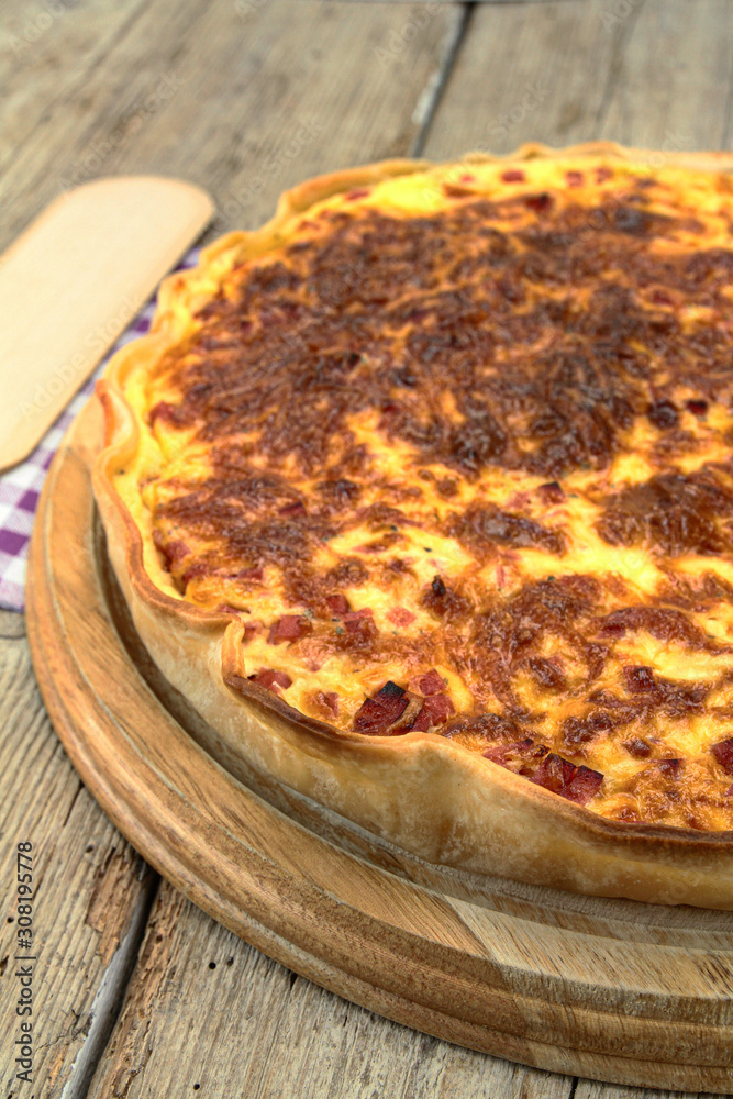 quiche Lorraine on a wooden table quiche Lorraine on a wooden table
