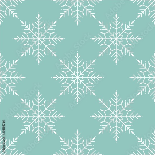 Winter seamless pattern with white snowflakes on blue background.