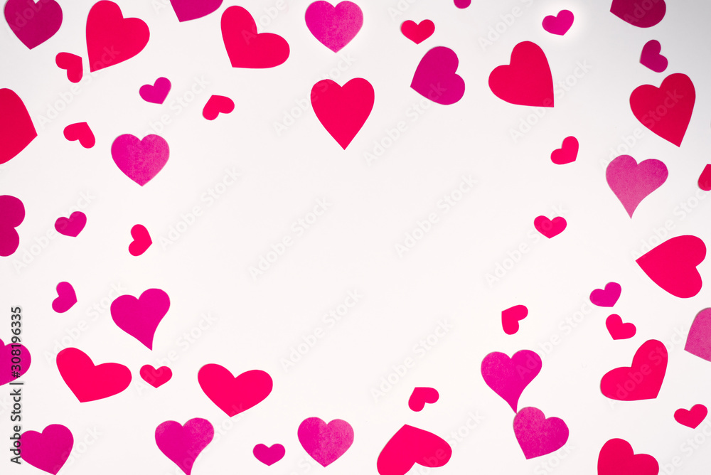 Frame of red and pink hearts on white background. Valentine's day love holiday. Holiday card with copy space