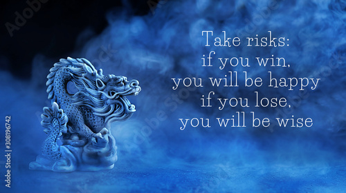 ake risks: if you win, you will be happy; if you lose, you will be wise - motivation quote. Chinese dragon statue on dark blue abstract background. dragon symbol of wisdom, good start, Imperial power