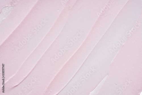 Gently pink strokes and texture of face cream or acrylic paint isolated on white background