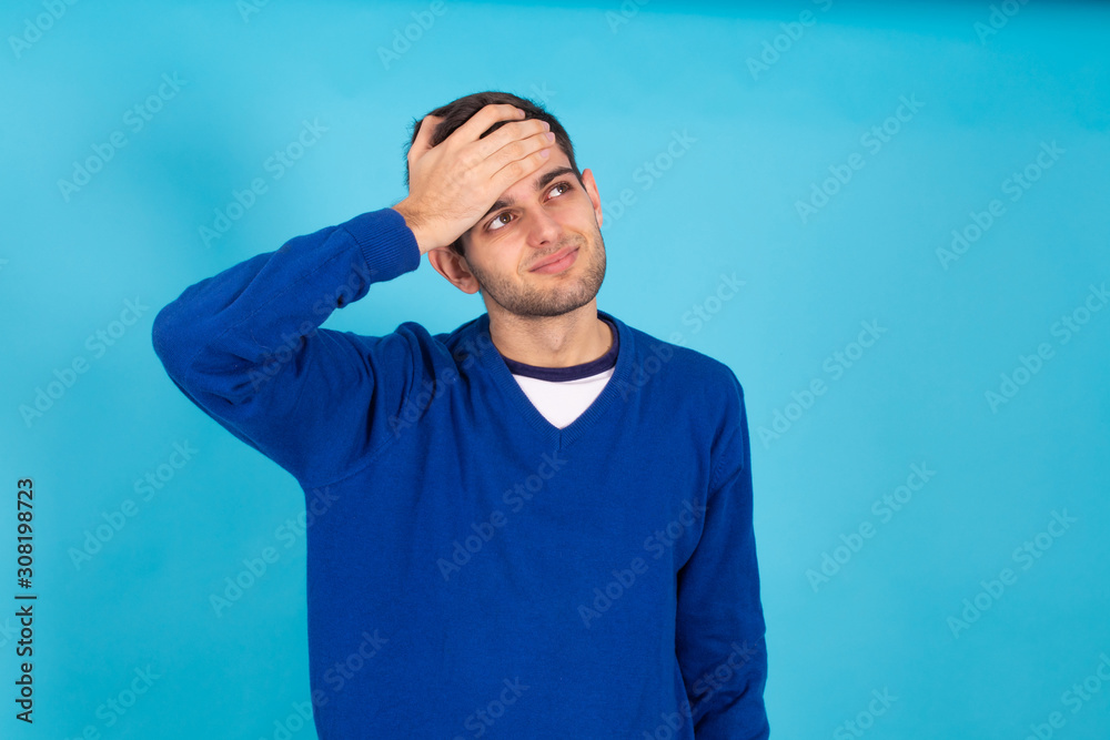 casual young man isolated on natural blue background casual young man isolated on natural blue background