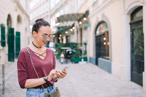 Photography Woman talk by her smartphone in city